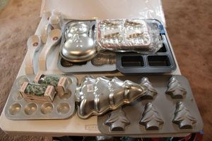 lot 203 image: Christmas cake molds and mini loaf pans, plus spoon rests