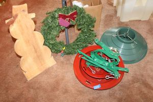lot 206 image: Christmas tree stands, wreath, and unpainted wood snowman