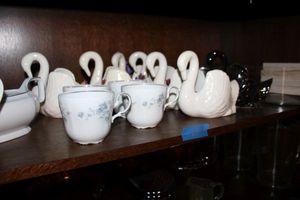 lot 270 image: Misc. home dcor ceramic swans, place markers And more