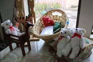 lot 278 image: Crafts Wooden reindeer, teddy bears with moveable arms and legs, basket with craft supplies