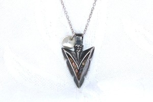 lot 328 image: Sterling Silver cable chain necklace with heavy sterling pendant in arrowhead form. 18L. Marked 925 Lotus Jewelry Studio 925GF and 925 on spring ring and back of pendant. 7.1 gr approx.