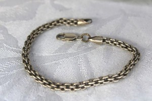 lot 330 image: Sterling Silver Italian rope chain heavy bracelet. 8L. Marked 925 Italy near lobster clasp. 13.4 gr approx.