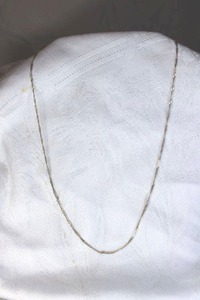 lot 331 image: Sterling Silver necklace with twisted chain design. Marked 925 near clasp. 19L