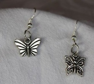 lot 332 image: Sterling Silver French ear wire earrings with butterfly dangles. Marked 925.About 1.25L