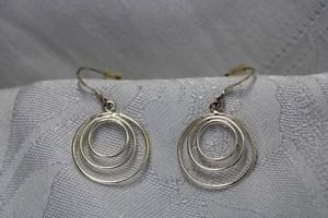 lot 333 image: Sterling Silver French ear wire concentric ring dangle earrings. Marked 925 on each earring. 1.25L