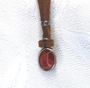 lot 334 image: Signed Silpada Sterling Silver Necklace with Carnelian double sided pendant. Marked 925 on lobster clasp and has Silpada hang tag. Rawhide leather cord necklace 16L