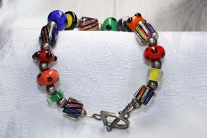 lot 341 image: Sterling Silver art glass bead bracelet with D-ring toggle clasp. Marked 925 on clasp. 8.5L