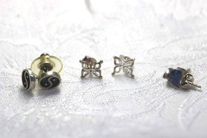 lot 338 image: (3) Sterling Silver poststud earring sets. Includes butterfly, Yin Yan peace symbol and Lapis Lazuli botehbuta shape. All marked 925 or Ster