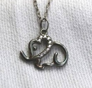 lot 363 image: Sterling Silver crystal decorated elephant pendant om 10L youth size necklace with 1 extender, Marked 925 on clasp.