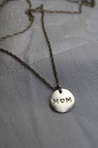 lot 364 image: Sterling Silver MOM round charm  pendant on 24L sterling necklace. (Marked 925 on spring ring clasp). Pendant marked 925 on reverse. 12 H approx.