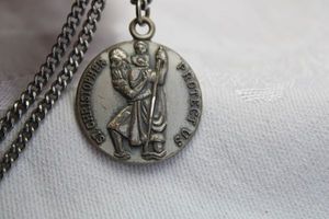 lot 369 image: Sterling Silver heavy Saint Christopher Protect Us medal on 24L chain. Marked Sterling on medal reverse. 1W