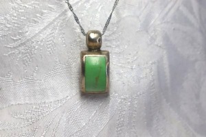 lot 358 image: Sterling Silver 19L chain necklace with green Turquoise pendant with large bale. Pendant 1.25L Marked ATI . 100% of ATI necklaces are exclusively sterling silver. Pendant Marked Mexico 825 on reverse.