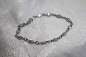 lot 376 image: Sterling Silver bracelet with oval faceted AB crystal stations. Marked 925 on spring ring clasp. 7.5L