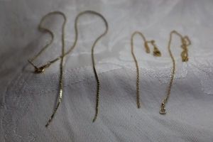 lot 384 image: (2) 14K vintage gold filled broken necklaces. Marked 1420 GF on lobster clasp and spring ring clasp. Both 16L