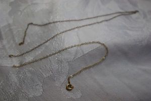 lot 386 image: 14K vintage gold filled broken necklace. Marked 120 14K GF on spring ring clasp. 16L