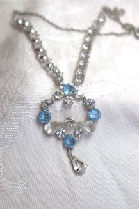 lot 388 image: 12K white gold filled prong set AB crystal dangle necklace with cable chain yoke. Marked 120 12K GF on spring ring clasp. 14L