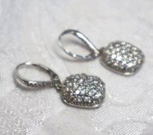 lot 406 image: Sterling Silver and rhinestone lever back dangle earrings. Marked 925. 1.25L