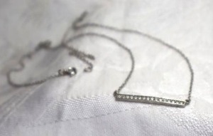 lot 407 image: Sterling Silver and CZ bar pendant necklace. Marked 925 CZ 18L