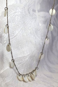 lot 409 image: Sterling Silver necklace with polished shell disc stations. Marked 925. 16L with 1 extender. Lobster clasp.