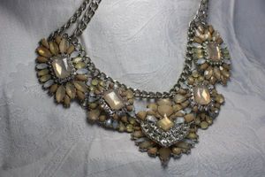 lot 421 image: Chunky marquise and teardrop cut glass festoon runway statement necklace with double strand silver finish necklace. Opalescent and taupe colored glass. 16L Lobster clasp.