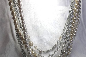 lot 449 image: Signed Lia Sophia multi strand silver AB and Faux pearl necklace. Marked Lia Sophia on infinity clasp. 24L with 3 extender.