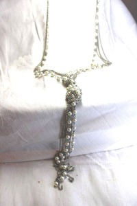 lot 462 image: Silver finish multi strand contemporary chain and faux pearl knot necklace with tassel. Lobster clasp. 28L and pendant drop 7L
