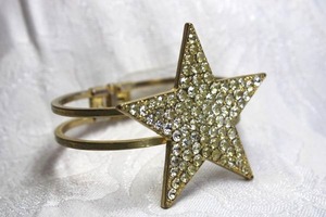 lot 467 image: Gold finish hinged bangle bracelet with champagne crystal studded star topper. Star 2W