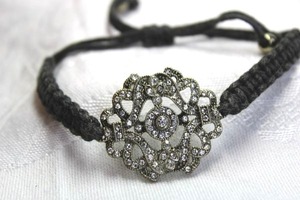 lot 472 image: Boho woven adjustable bracelet with pull closure and rhinestone focal medallion 1W