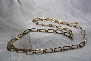 lot 489 image: Gold finish oval link fancy chain with rhinestone decorated paper clip style carabiner links. Lobster clasp. 18L and 3 extender.