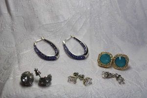 lot 495 image: (5) Rhinestone poststud earring selection. Hoop has insideoutside faceted purple rhinestones.