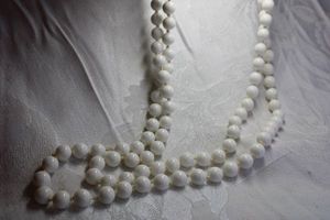 lot 499 image: White acrylic bead vintage necklace with covered hidden clasp. Marked West Germany (1949-1990). 54L