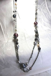 lot 501 image: Multi color graduated faux pearl station continuous necklace. 58L Pearls are copper, grey, white and black