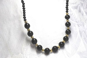 lot 502 image: Classic timeless black glass bead necklace with gold ball stations. 16L with 2 extender.
