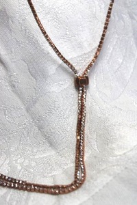 lot 520 image: Elegant rose gold color rhinestone lariat style necklace with sliding adjust bead. 48L