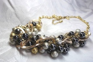 lot 522 image: Signed NY black, silver and gold bead necklace with cable chain yoke. Has NY hang tag. Lobster clasp. 14L with 3 extender.