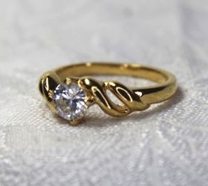 lot 527 image: Elegant and timeless gold plated CZ solitaire ring. Size 9.