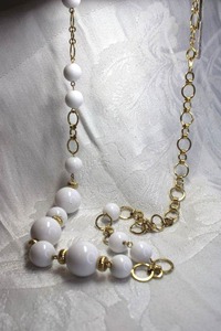 lot 531 image: Gold finish and white ball station vintage necklace with spring ring clasp. Made in Japan with vintage tag. 28L