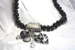 lot 544 image: Black acrylic freeform bead necklace with silver and black pendant with acrylic heart plus. Lobster clasp. 22L. Drop is about 3.5L