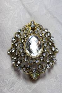 lot 552 image: Large convex shape rhinestone and crystal broochpin with 2 tie tack style pin backs. 3L x 2.5W