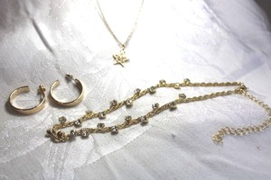 lot 555 image: Gold finish rhinestone jewelry. Includes (2) necklaces and gold plated hoop poststud earrings. Necklaces 18L and 16L with 3 extenders. Lobster clasps.