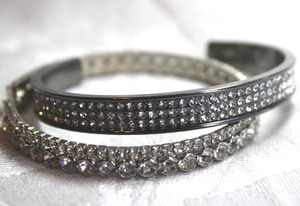 lot 556 image: (2) Silver finish rhinestone cuff bracelets
