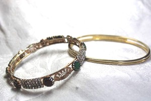lot 557 image: (2) Gold finish rhinestone cuff bracelets