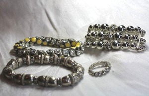 lot 562 image: (3) Silver finish large bead and rhinestone accented bracelets. One has yellow enamel. Includes a rhinestone vintage swedged ring Adjustable size 8
