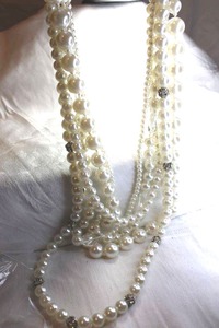 lot 570 image: Signed White House Black Market graduated and multi sized faux pearl multi strand pearl necklace with crystal pave station beads. Has WHBM hang tag. 22L with 3 extender. Lobster clasp.