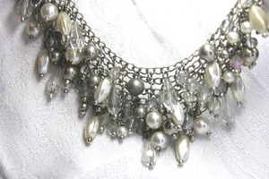 lot 572 image: Silver finish necklace with bib style mixed material bi colored pearl and metal dangles. 16L with 2 extender. Lobster clasp.