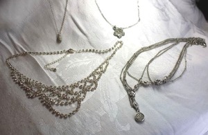 lot 586 image: (4) rhinestone silver finish necklaces.