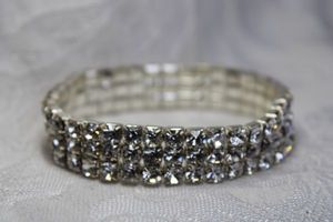 lot 476 image: Triple strand prong set rhinestone metal stretch bracelet