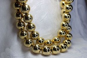 lot 431 image: Polished large gold metal ball bead necklace on chain with toggle clasps. Can be worn separate or together by linking. Each section is 18L or 36L together. Bright polished well made durable necklace.