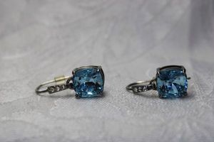 lot 443 image: Faceted caged prong set London Blue color glass French ear wire earrings. 1L