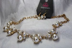 lot 444 image: Paparazzi branded pearl, faceted crystal and rhinestone cluster station necklace with matching ear wire earrings on branded card. 18L